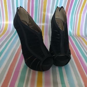 Black 5 inch heels with stripe cut outs size 7